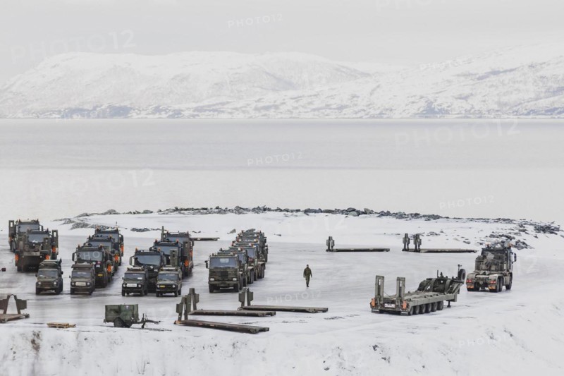 Military vehicles stand in a car park as part of the NATO exercise Nordic Response near Sorstraumen, 6 March 2024. 20, 000 soldiers from 13 countries will take part in the exercise, which will mainly take place in Scandinavia from 3 to 14 March. Following NATO enlargement, soldiers from Sweden and Finland are also taking part in the exercise for the first time