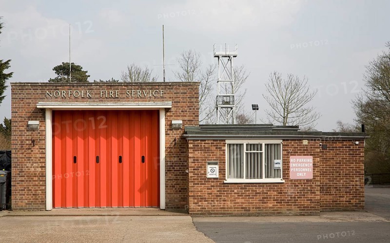 Red doors of small fire station at Loddon, Norfolk, England, United Kingdom, Europe