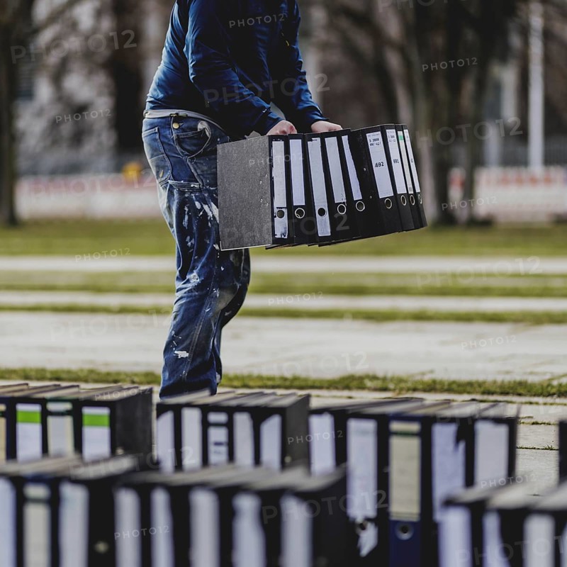 Files are cleared away after a protest action by the German Confederation of Skilled Crafts in front of the Federal Chancellery in Berlin, 26 February 2024. The German Confederation of Skilled Crafts demonstrates against the economic policy of the federal government as well as the high level of bureaucracy and the improvement of location conditions