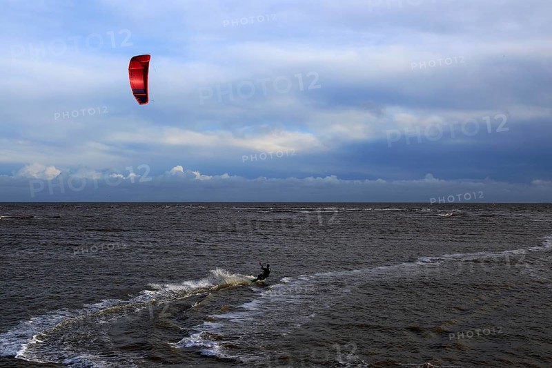 Kite surfing in North Sea at Shingle Street, Suffolk, England, UK