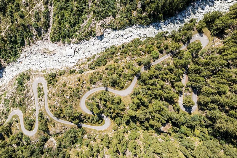 Aerial view of windy road in a mountain valley, Valais, Switzerland, Europe
