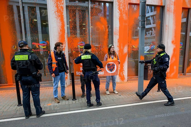 Police confiscate Last Generation banner after colour attack on Total Energies building Berlin, 06.11.2024