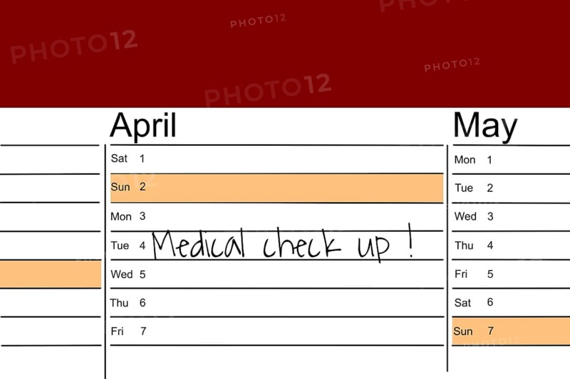 Symbolic image: Appointment diary with note for preventive medical check-up (English)