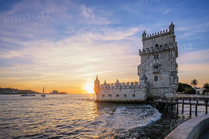 Belem Tower or Tower of St Vincent, famous tourist landmark of Lisboa and tourism attraction, on the bank of the Tagus River Tejo on sunset. Lisbon, Portugal, Europe