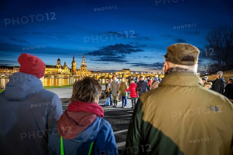 On 13 and 14 February 1945, Dresden was heavily destroyed in three Allied bombing raids. Every year, the people of Dresden commemorate this event at various events. A long human chain symbolised the protection of the city centre. Here looking from the Königsufer across the Elbe to the Old Town, Dresden, Saxony, Germany, Europe