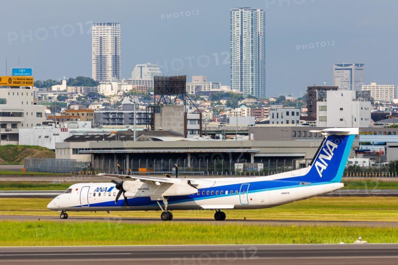An ANA Wings Dash 8 Q400 aircraft with registration number JA847A at Itami Airport (ITM) in Osaka, Japan, Asia