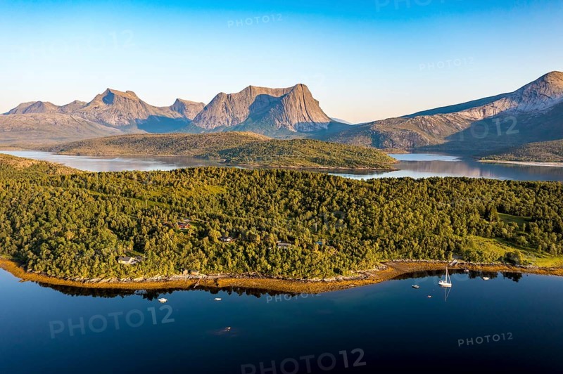 Aerial view over the fjord Efjord south of Narvik, seen at sunset, leisure boats anchor, holiday huts, calm sea, Norway, Europe