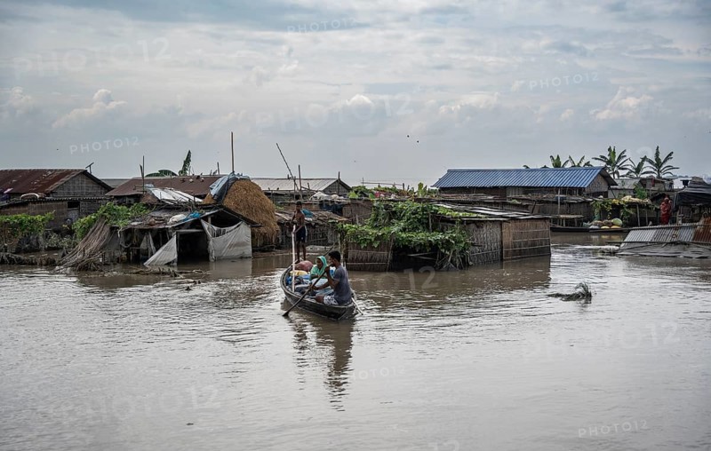 Morigaon, India. 4 July 2024. A settlement is partially submerged in flood in Morigaon district in India's northeastern state of Assam on July 4, 2024. Torrential rains and surging rivers across northeast India have killed at least nine people, with more than 1.5 million people affected