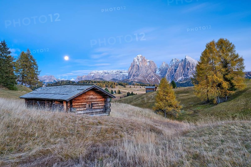 Autumn on the Seiser Alm, Alpine huts with Plattkofel and Langkofel, blue hour, full moon, Dolomites, South Tyrol