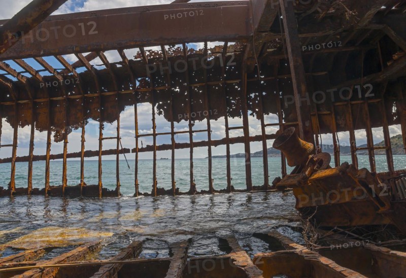 Rusty, dilapidated shipwreck with a view of the sea through a corroded metal structure, Dimitrios shipwreck, Glyfada beach, Selinitsa, Gythio, Githio, Gythion, Mani, Laconia, Peloponnese, Greece, Europe