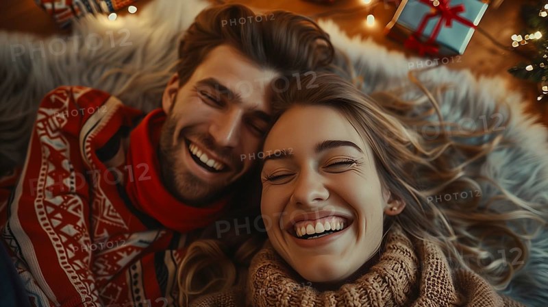 Young couple laying on their backs surrounded by christmas gifts and decorations laughing. generative AI., AI generated