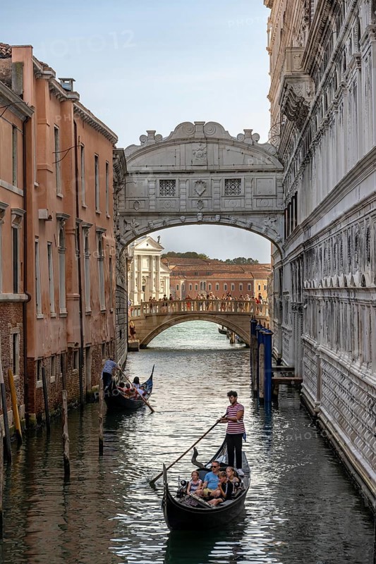Venetian gondolas on the Rio di Palazzo canal with Bridge of Sighs, Venice, Veneto, Italy, Europe