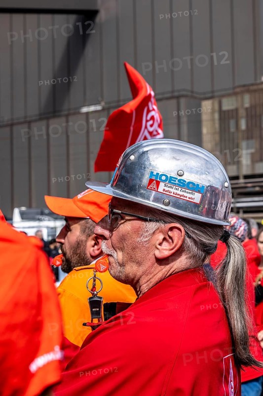 Steelworkers at a demonstration in front of the headquarters of ThyssenKrupp Steel Europe in Duisburg, against massive job cuts, after the participation of a foreign investor in the group, in the background the Oxygen steelworks, Duisburg North Rhine-Westphalia, Germany, Europe