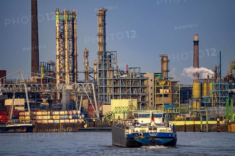 Backdrop of Chempark Leverkusen, Bayer Leverkusen, chemical park, chemical plant, river Rhine, cargo ship, Leverkusen, North Rhine-Westphalia, Germany, Europe