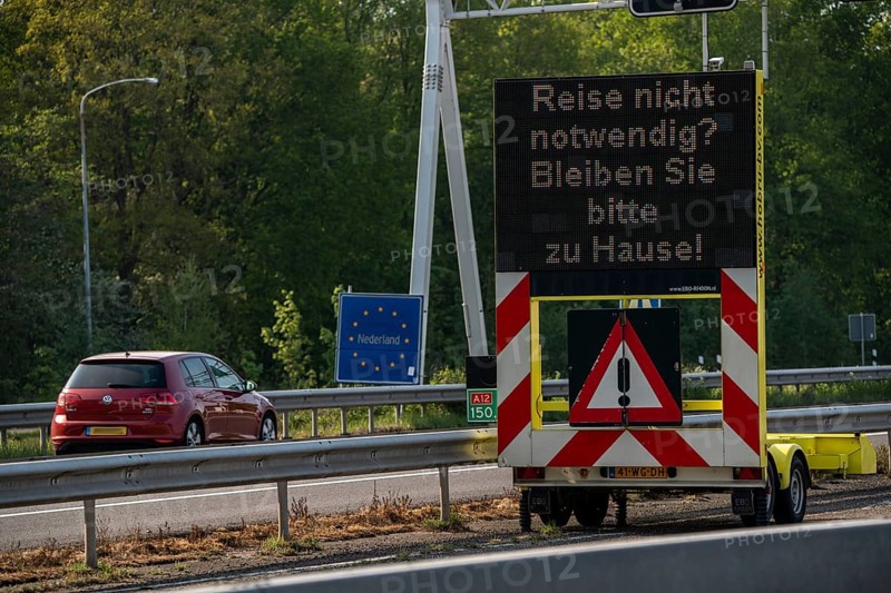 German-Dutch border at Emmerich-Elten, A3 motorway, signal board asks travellers to only make necessary journeys to the Netherlands, effects of the corona crisis in Germany