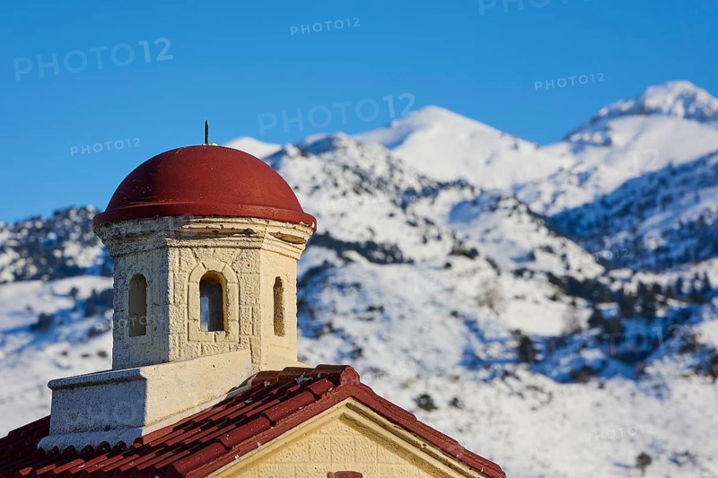 Close-up of a church tower with a red roof in the snowy mountains under a clear sky, Lefka Ori, White Mountains, mountain massif, west, Crete, Greece, Europe