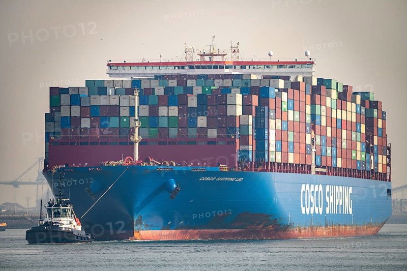 Harbour tug brings the container freighter Cosco Shipping Leo to its berth at Hutchison Ports ECT Euromax, at the Yangtzekanaal on Maasvlakte 2, Rotterdam, Netherlands