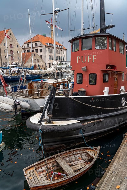 Ships and boats on Christianshavns Kanal, old district, at the same time very lively and hip neighbourhood, crossed by many canals, with shops, pubs, living space, Copenhagen, Denmark, Europe