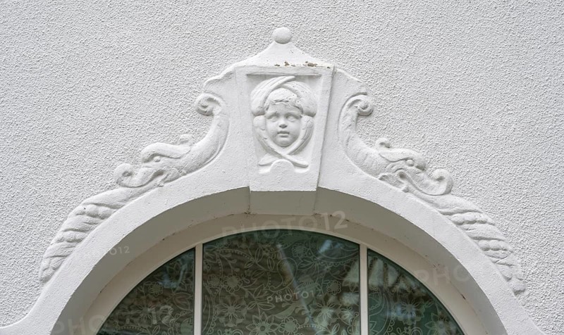 Relief of a boy's head above the fenaster of the oldest kindergarten in Lauf, 1850, Alter Schulhof 1, Lauf an der Pegnitz, Middle Franconia, Bavaria, Germany, Europe