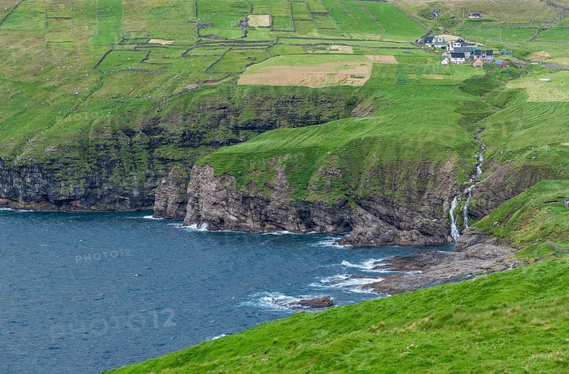 Coastal view with waterfall and Vidareidi village, Vidoy Island, Viðareiði, Viðoy Island, Faroe Islands, Denmark, Europe