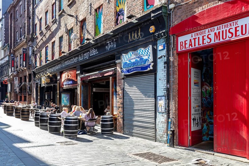 Urban scene with the Beatles Museum and outdoor cafés, Liverpool