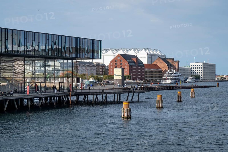 New Playhouse or Skuespilhuset, Royal Theatre, Kvæsthusbrø, in the background headquarters of the Møller-Mærsk Group, also known as Maersk and brick building with collection of classical European sculptures, former warehouse, harbour, Copenhagen, Denmark, Europe
