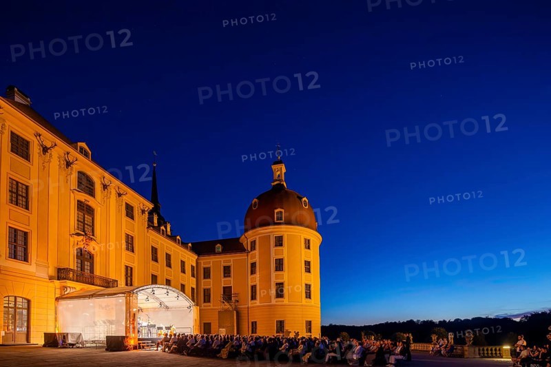 The Moritzburg Festival is an annual chamber music event in Saxony. It was founded in 1993 in Moritzburg by the soloists Kai Vogler, Peter Bruns and Jan Vogler. In Moritzburg, the artists find the ideal setting for the realisation of their musical dreams. The Moritzburg Festival, which has been under the sole artistic direction of cellist Jan Vogler since 2001, has long since established itself internationally as one of the most important festivals for chamber music thanks to its exceptional quality. Here is an evening concert on the north terrace of the baroque palace, Moritzburg Chamber Music Festival, Moritzburg, Saxony, Germany, Europe