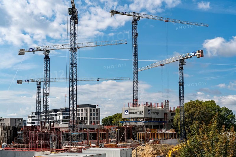 Construction cranes on two large construction sites, construction of office buildings in Dortmund-Schüren-Neu, North Rhine-Westphalia, Germany, Europe