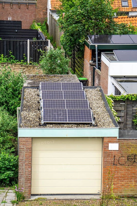 Solar modules on roofs, here on a car garage, Vlissingen, Netherlands