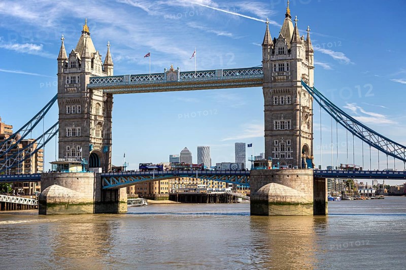 Historic Tower Bridge with twin towers over the River Thames under a clear sky, surrounded by city view, London, United Kingdom United Kingdom