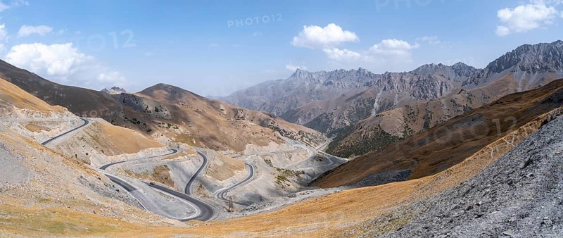 Winding roads on the Pamir Highway, mountain road through an eroded mountain landscape, Kyrgyzstan, Asia