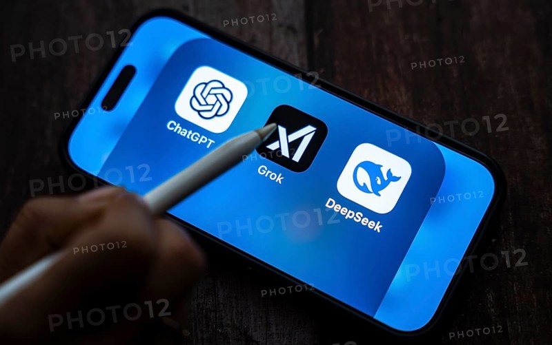 New Delhi, India. 12 February 2025 : In this photo illustration Grok, an AI chatbot by xAI, ChatGPT, Deepseek app icons seen in an iPhone screen. Generative AI and modern chatbot tech concept