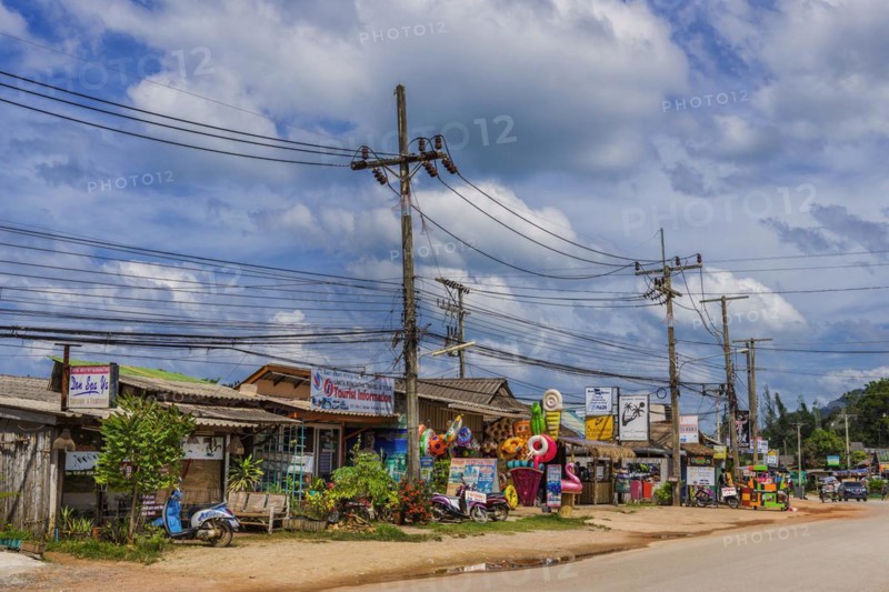Street scene with general shop in the old town of Ko Lanta, dilapidated, row of houses, town, urban, live, living, Asian, street, exotic, architecture, holiday island, tourism, travel, long-distance travel, village, urban, tourism, shop, shop, bizarre, colourful, typical, power cable, power poles, developing country, sale, stall, traditional, village, Thailand, Asia