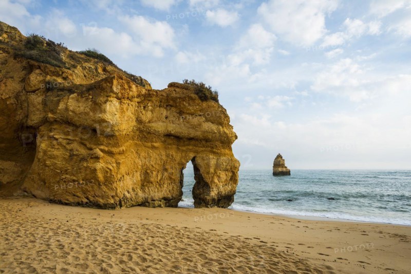 Rocky coast with beach and red rocks, Praia do Camilo, Lagos, Algarve, Portugal, Europe
