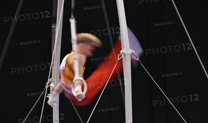 Gymnastics, artistic gymnastics, gymnasts, men, feature, movement, movement effect, wipe effect, rings, EnBW DTB-Pokal 2024, Porsche Arena, Stuttgart, Baden-Württemberg, Germany, Europe