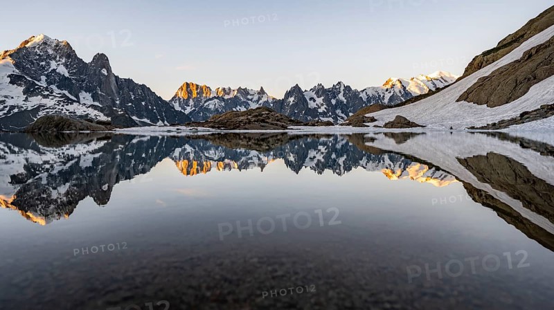Morning atmosphere at a mountain lake, mountain landscape at sunrise, water reflection in Lac Blanc, mountain peak, Aiguille Verte, Grandes Jorasses, Aiguille du Moine, Mont Blanc, Mont Blanc massif, Chamonix-Mont-Blanc, Haute-Savoie, France, Europe