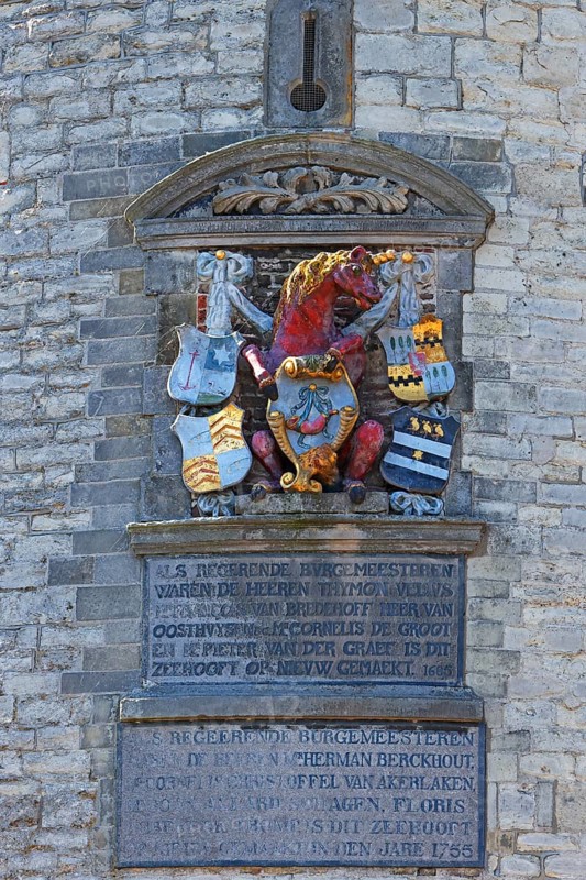 City coat of arms with unicorn on the historic Hoofdtoren defence defence tower in the harbour of Hoorn, Markermeer, part of the IJsselmeer, province of North Holland, West Friesland, Netherlands