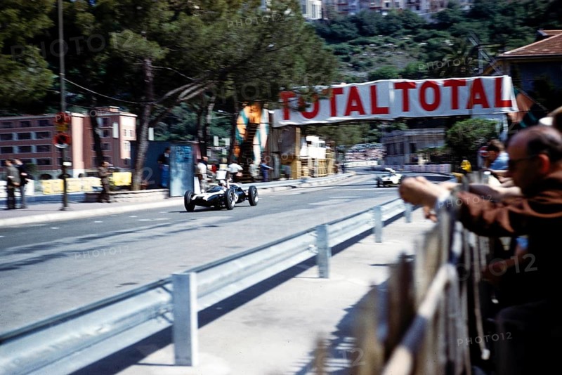 Formula One race at the 1961 Monaco Grand Prix, Bruce McLaren in the Cooper Climax racing car, passing the pits