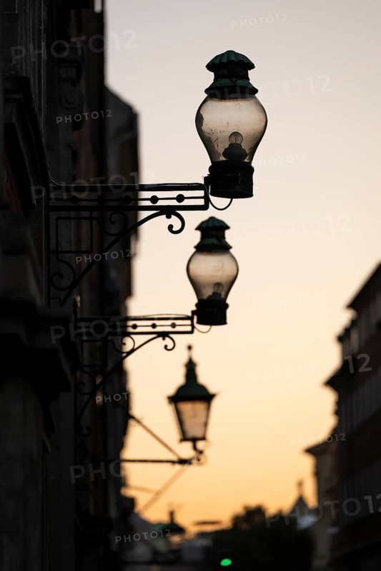 Silhouette of historic street lamps or street lanterns in the evening light, nostalgic atmosphere, Copenhagen, Denmark, Europe
