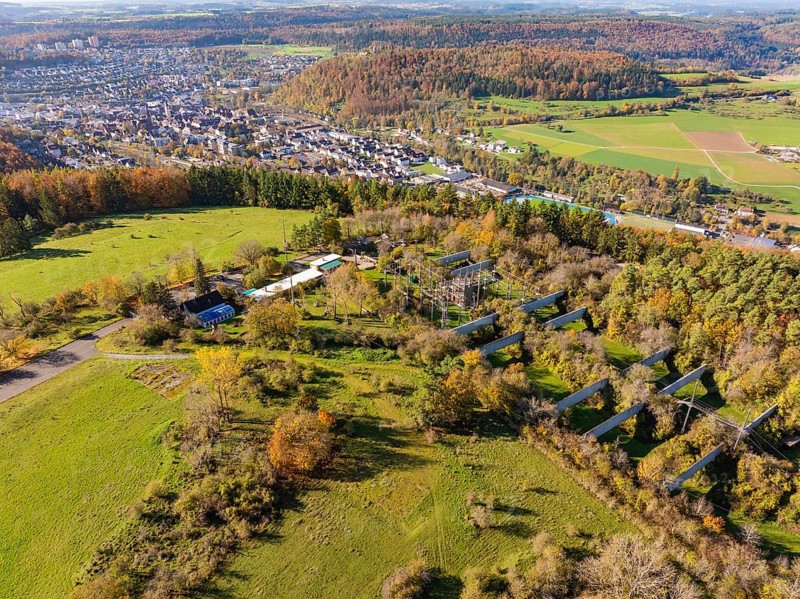 Hilly landscape with a village, autumnal trees and extensive fields in the countryside, high ropes course, Nagold, Black Forest, Germany, Europe