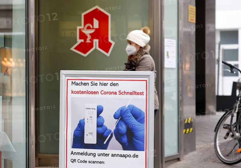 Düren, North Rhine-Westphalia, Germany - Pharmacy offers free corona rapid test, Düren city centre in times of the corona crisis during the second lockdown, most shops are closed, only a few passers-by are out and about in the pedestrian zone