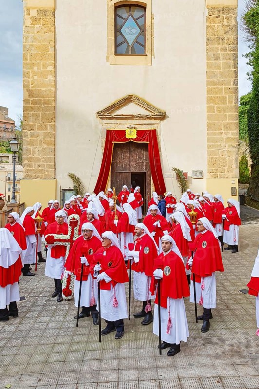 Confraternity of penitents gathering outside San Leonardo church, Enna, Siclly, Italy, Europe