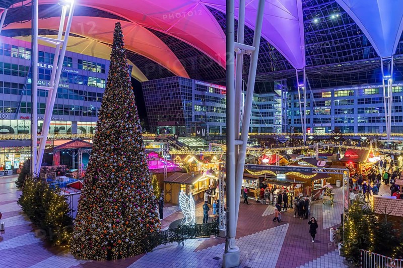 Christmas market at the airport in the evening, market stalls decorated for Christmas in front of the terminal Munich, Bavaria, Germany, Europe