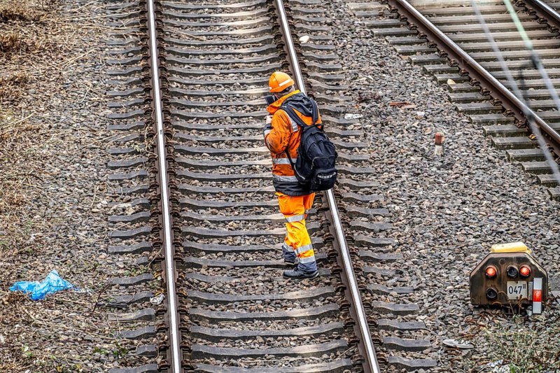 Worker on the railway tracks, after the end of his shift, walking home from the tracks, North Rhine-Westphalia, Germany, Europe