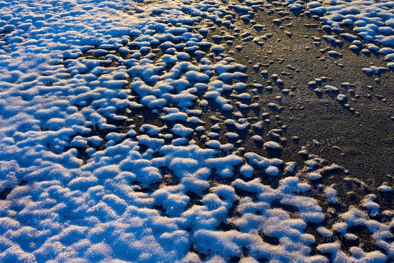 Snow cover with contrasting patterns in the light of the setting sun, winter, Wasserkuppe, Gersfeld, Rhön, Hesse, Germany, Europe