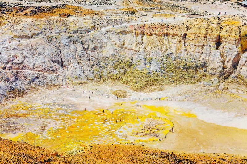 People walking around Stefanos crater moonlike landscape, Nisyros Island, Dodecanese Islands, Greece, Europe