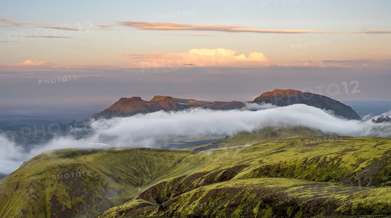 Fog between mountains, moss-covered volcanic mountain landscape, at sunset, Pakgil, Iceland, Europe