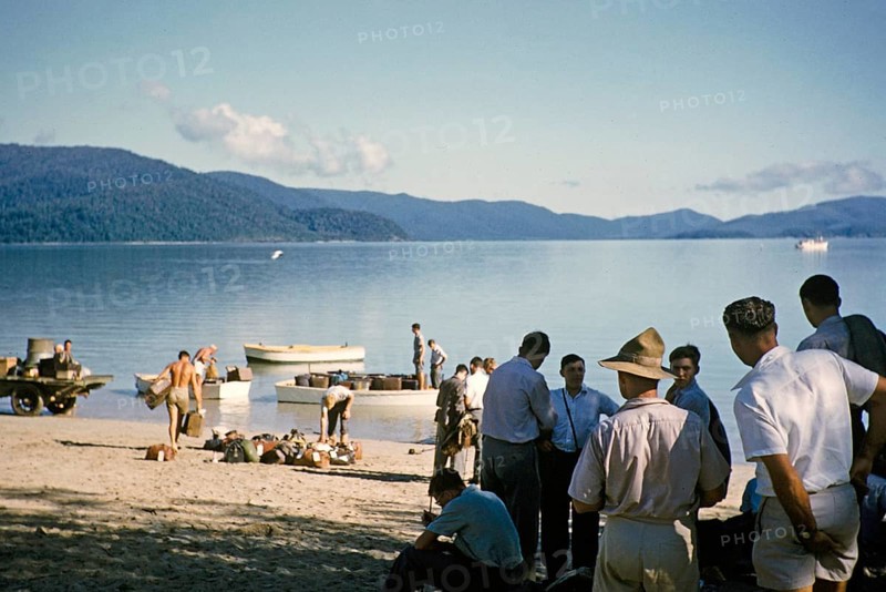 Melbourne Grammar School expedition to Queensland, Australia, 1956 Boys on the beach transferring their luggage to small boats, Whitsunday Islands, Oceania