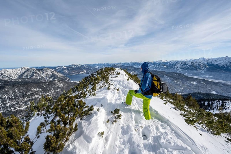 Ski tourer at the summit of Simetsberg, mountain panorama, Estergebirge, Bavarian Prealps, Bavaria Germany