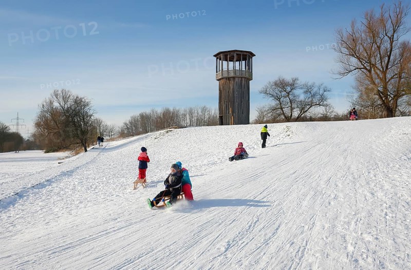 Recklinghausen, North Rhine-Westphalia, Germany - Sunny winter landscape in the Ruhr area, Emscher art in the snow, Kawamata Tower on the Emscher, WALKWAY AND TOWER, 2010, by Tadashi Kawamata, Children sledging